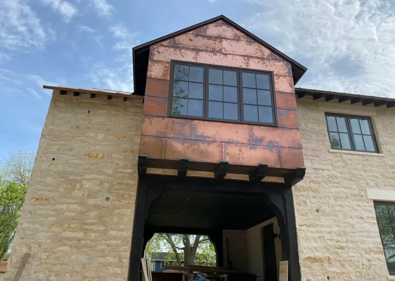 Copper metal panel facade on a stone building for Skylight Installation in Milpitas